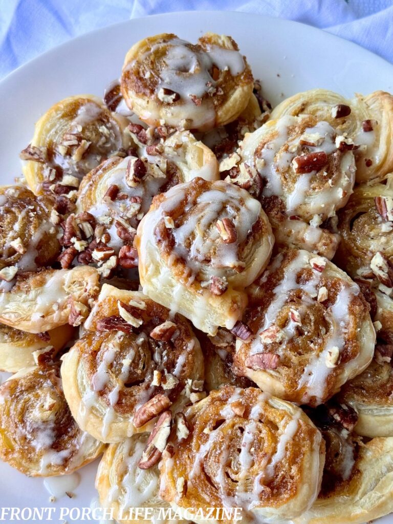 Mini Cinnamon rolls made with puff pastry on a white dish