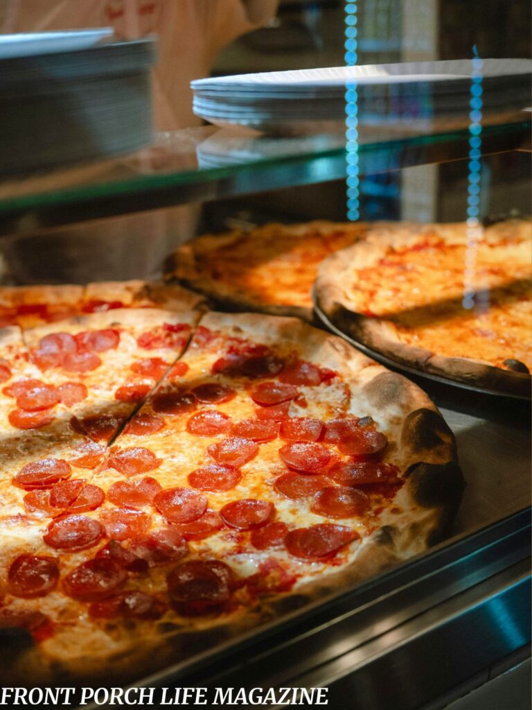 Pizza slices on a warming plate