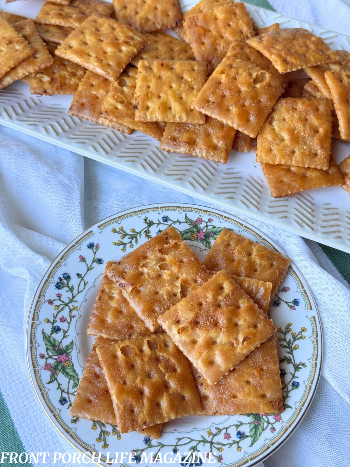buttered Saltine crackers on a dish