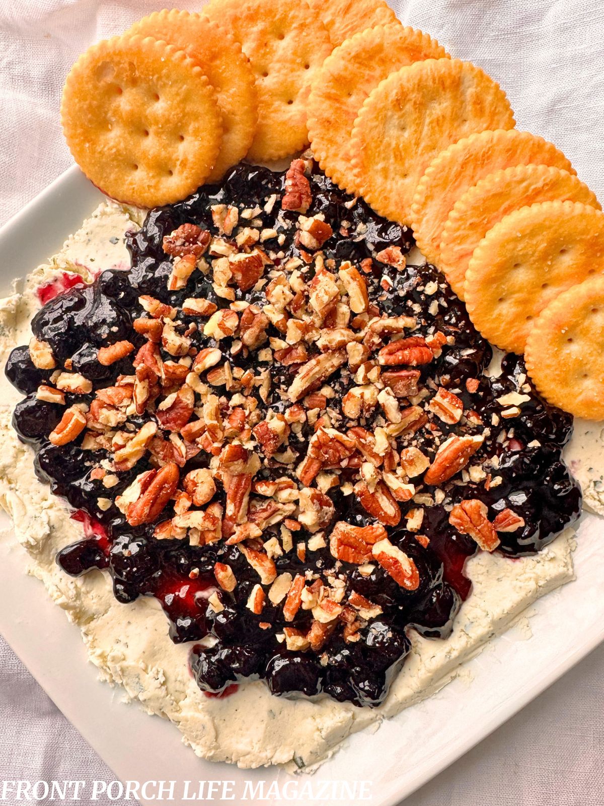 Blackberry boursin cheese dip on a white plate