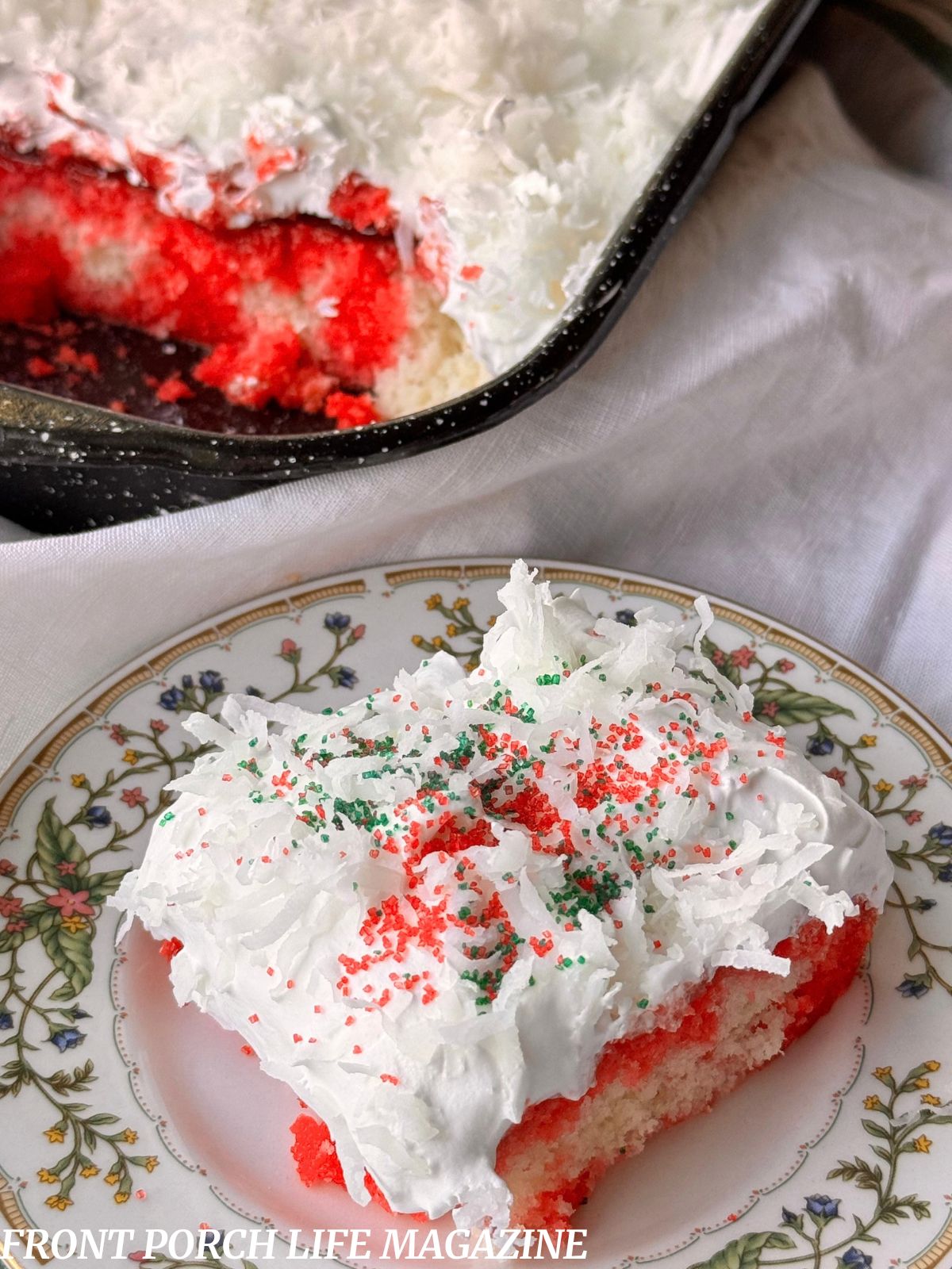 Raspberry Zinger Poke Cake on a plate